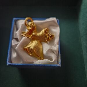 Vintage textured satin gold tone Robyn Rush angel with bell pin brooch